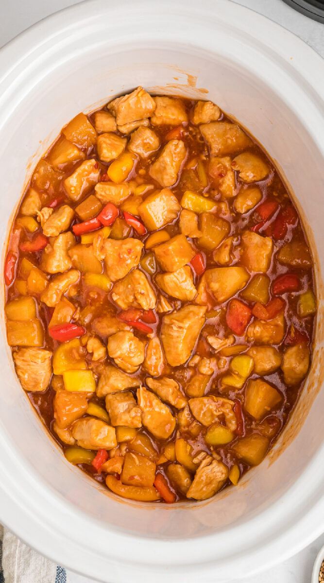 Cooked sweet and sour chicken in a slow cooker, photo for pinterest.