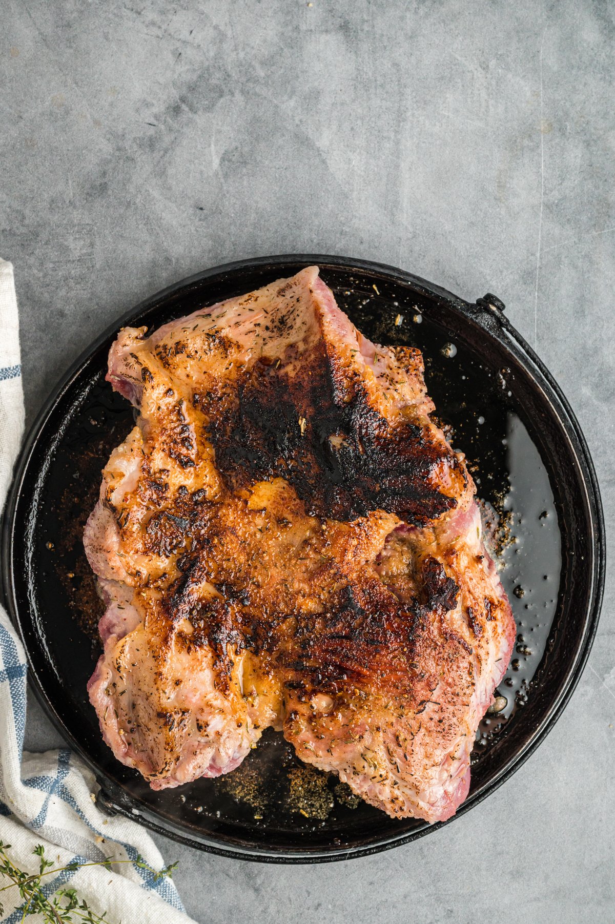 pork roast being browned in a crockpot.