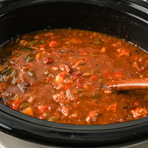 side view of goulash in a crockpot.