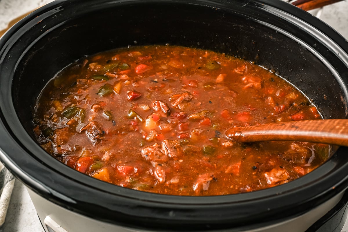 side view of goulash in a crockpot.