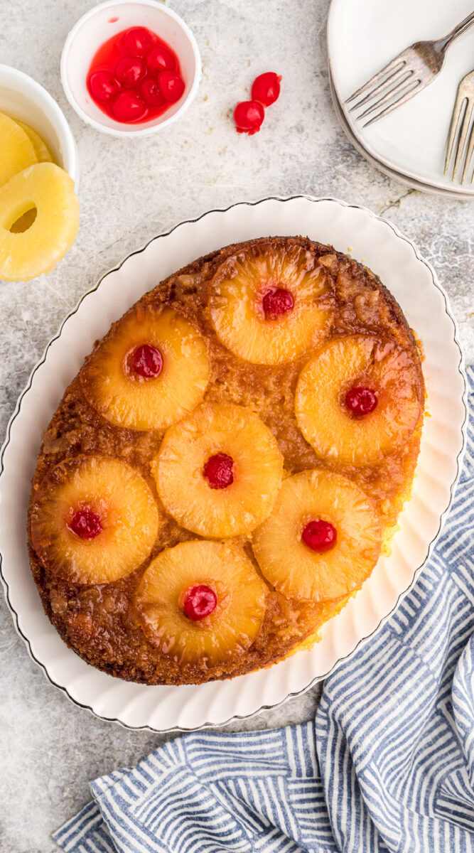 Long image of pineapple cake with cherries for pinterestl.