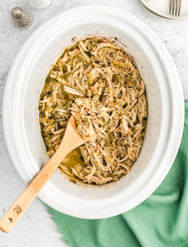 salsa verde chicken, shredded in the slow cooker.