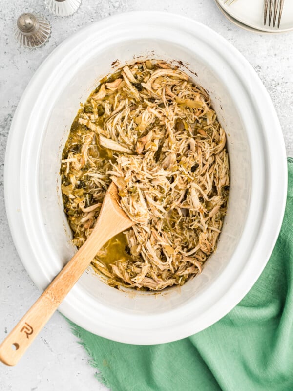 salsa verde chicken, shredded in the slow cooker.