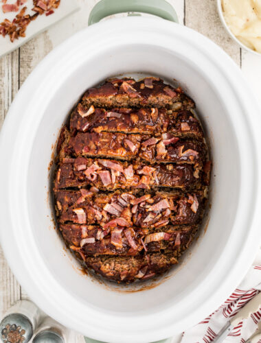 sliced meatloaf in a slow cooker.