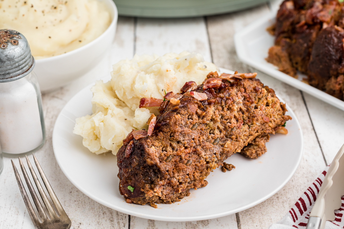 a piece of mealoaf on a plate.