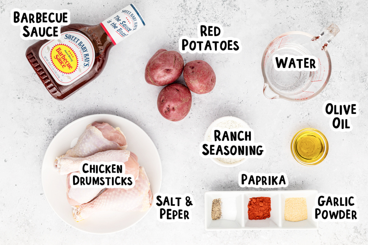 Ingredients for barbecue chicken and drumsticks on a table.