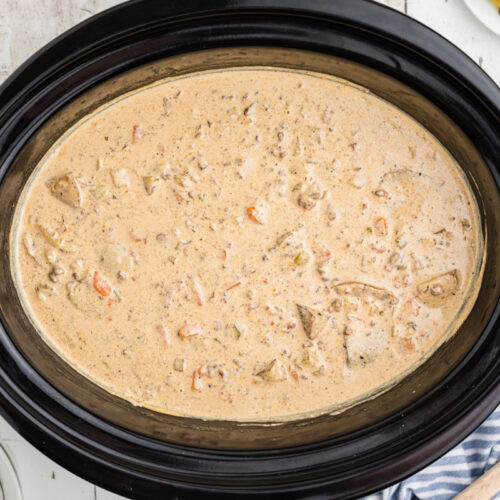 overhead shot of cheeseburger soup in a crockpot.