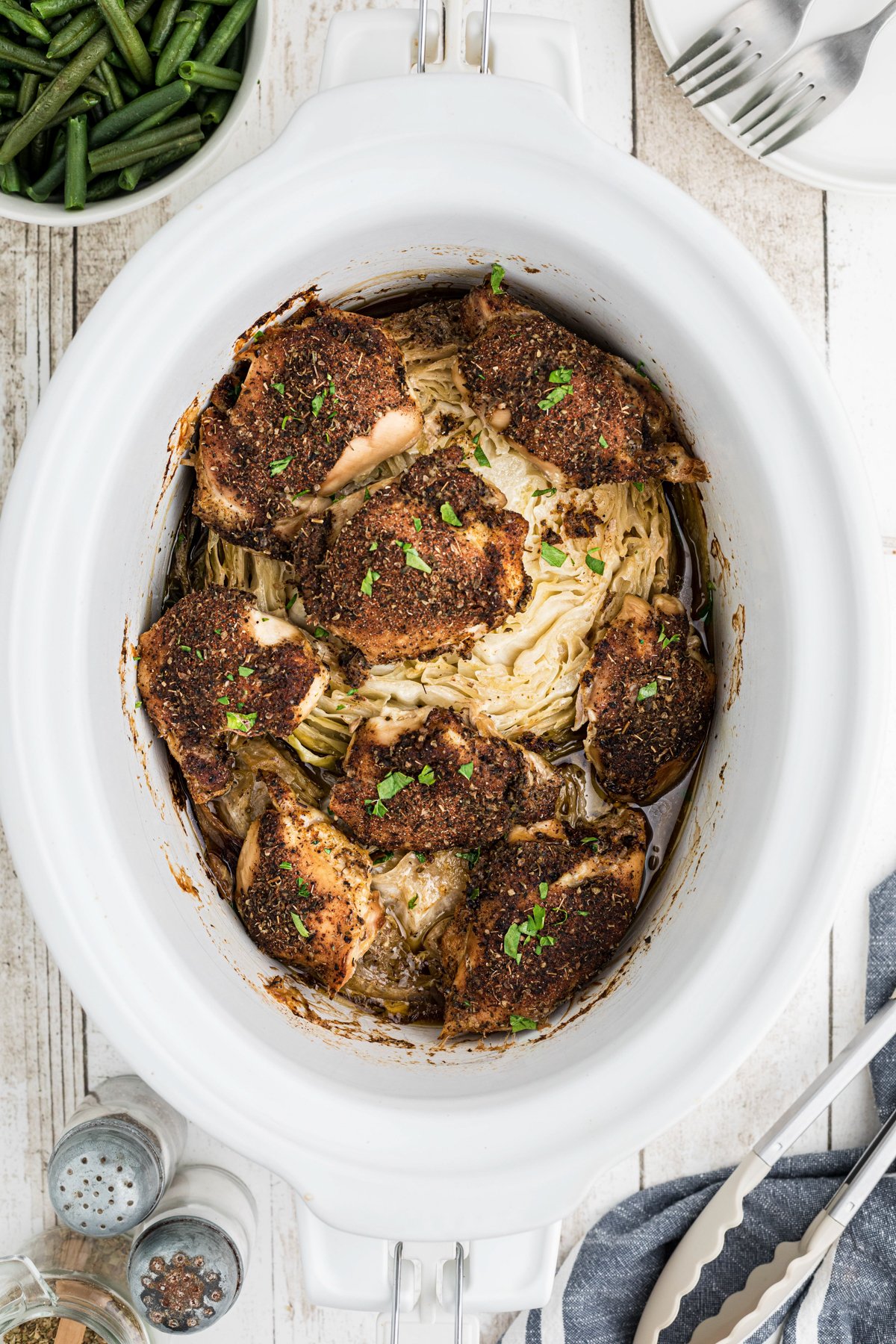 Chicken and cabbage cooked in a crockpot.