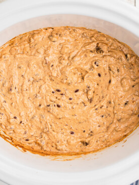 chili and cream cheese cooked in a slow cooker.