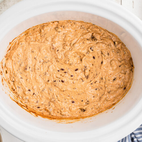 chili and cream cheese cooked in a slow cooker.