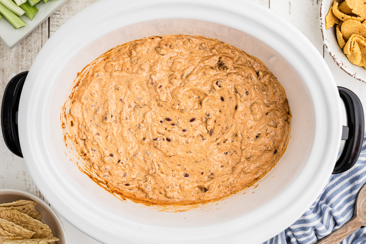 chili and cream cheese cooked in a slow cooker.