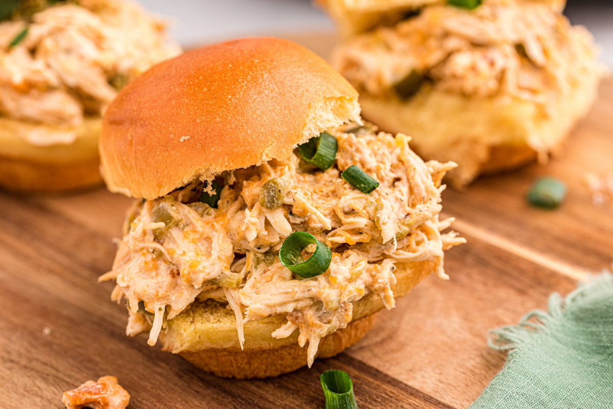 a jalapeno chicken slider on a cutting board.