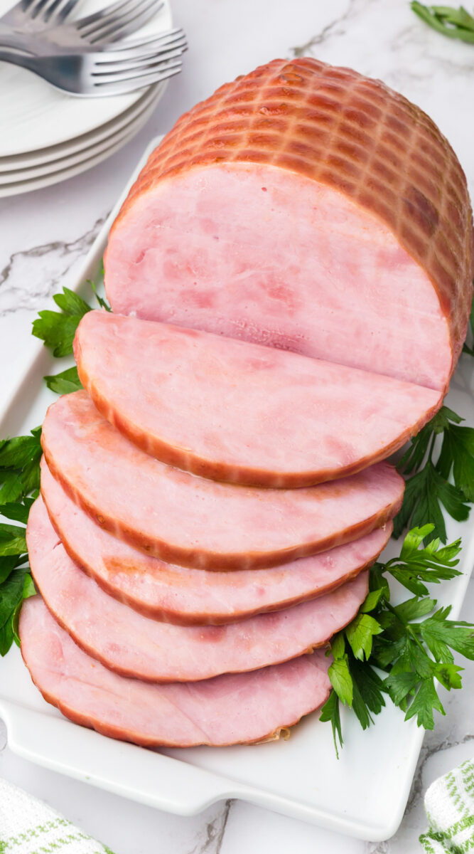 Sliced ham on a platter.