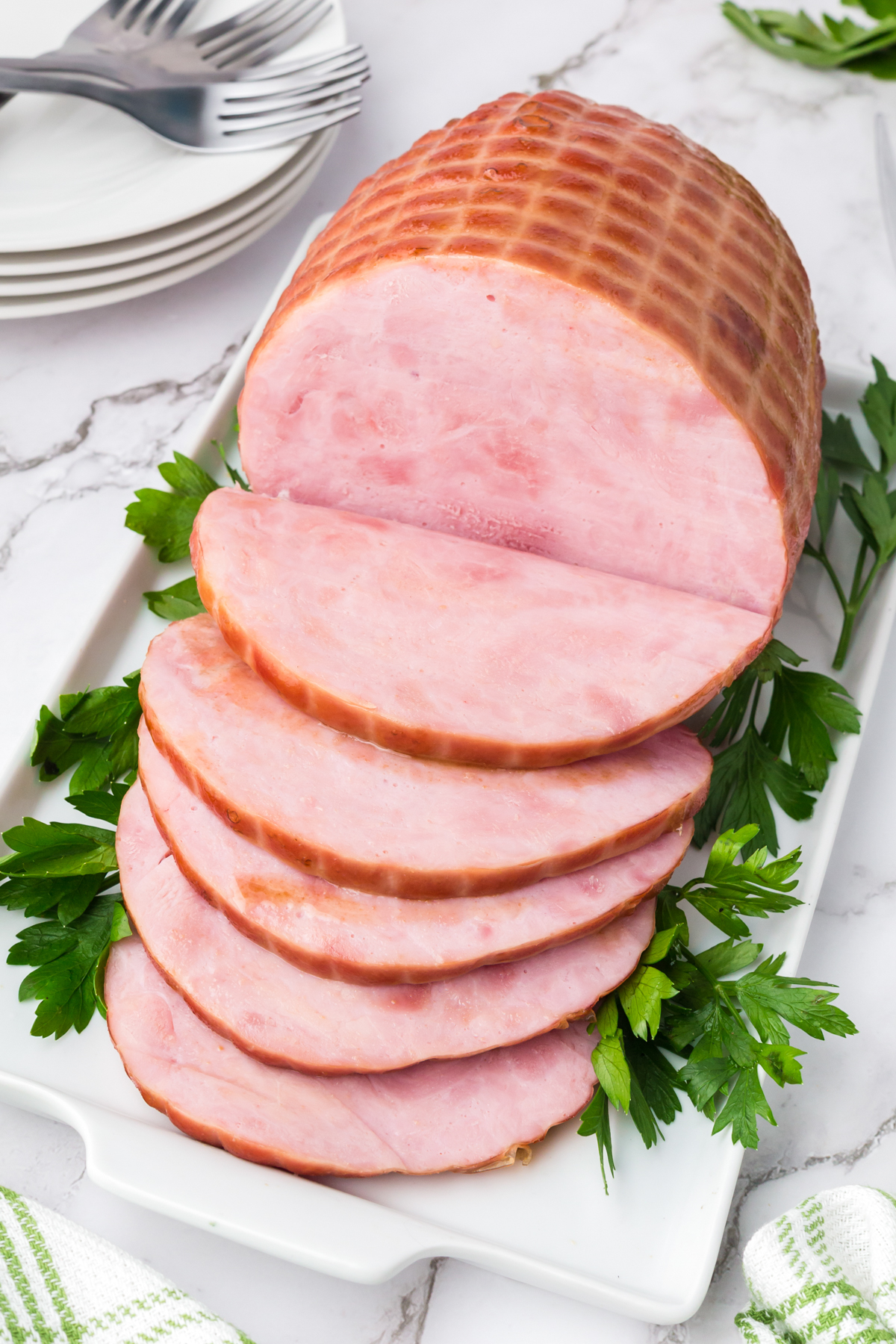 sliced maple ham on a platter.