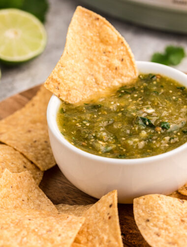 Chip in tomatillo salsa.