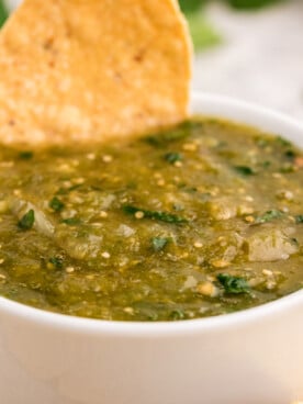 close up image of salsa and chip.