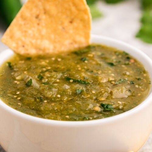 close up image of salsa and chip.