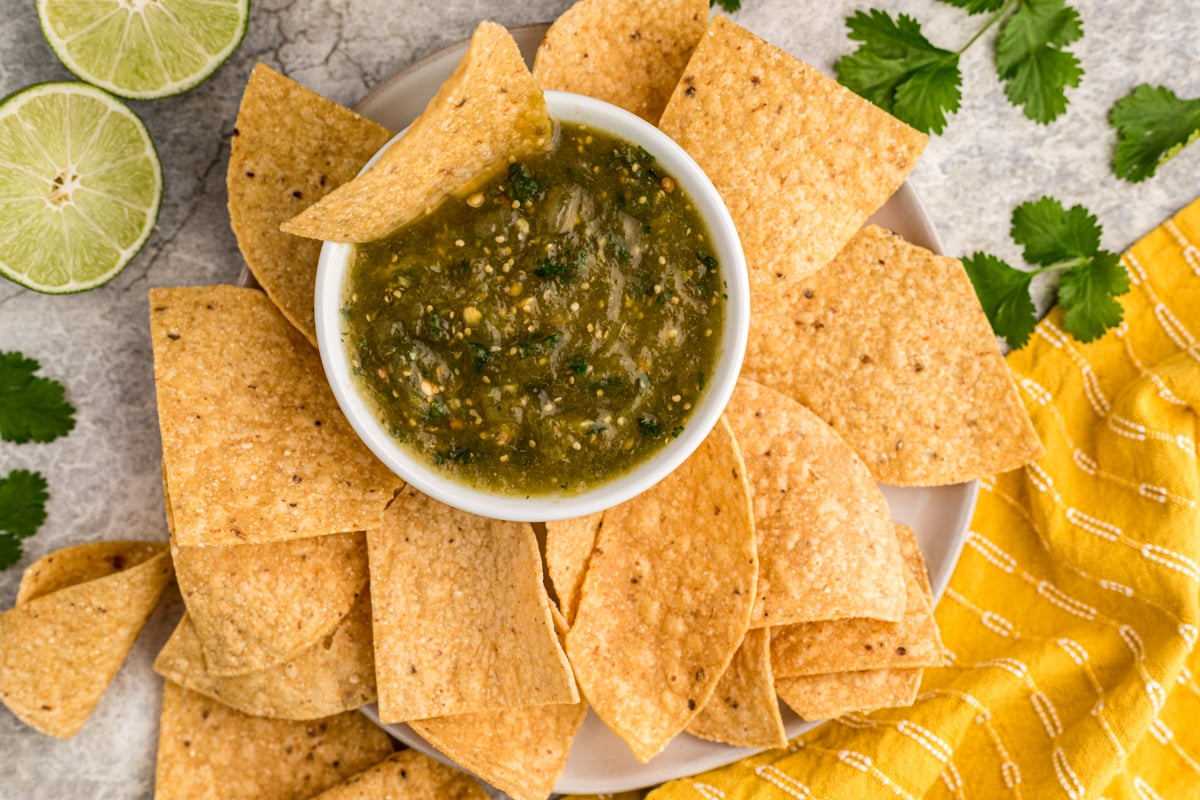 overhead shot of tomatillo salsa and tortilla chips.