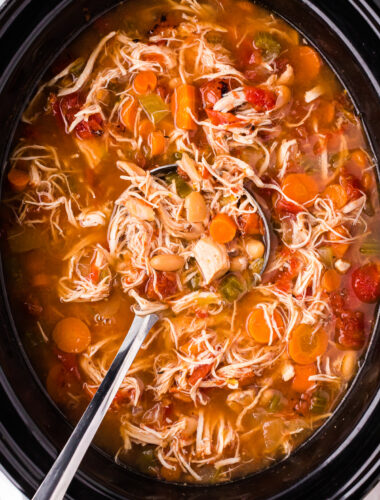 close up of tuscan white bean soup in the slow cooker.