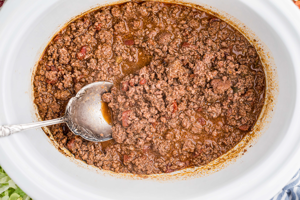 overhead shot of venison taco meat with a spoon in it.