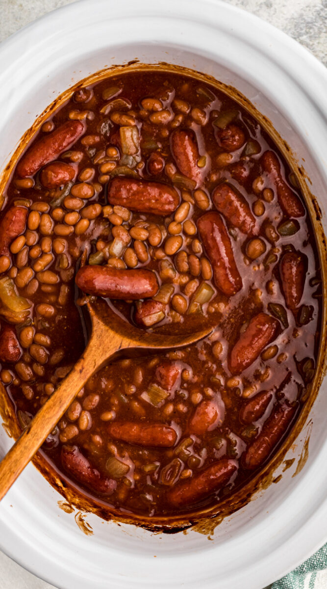 long image of baked beans and little smokies.