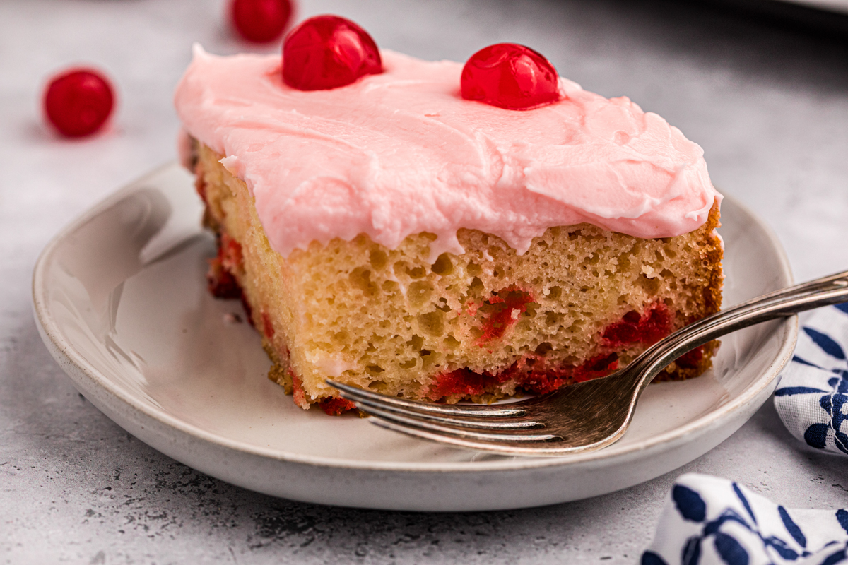 slice of cherry cake on a plate.