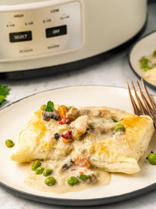 puff pastry with chicken ala king sauce in front of a slow cooker.