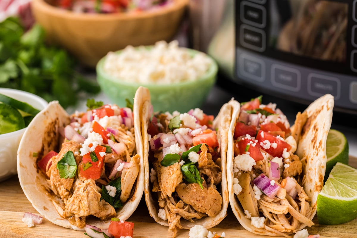 Three cool ranch tacos on a cutting board.