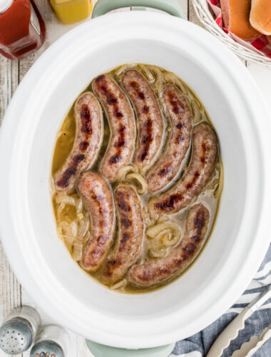 Brats in onion and beer in slow cooker.