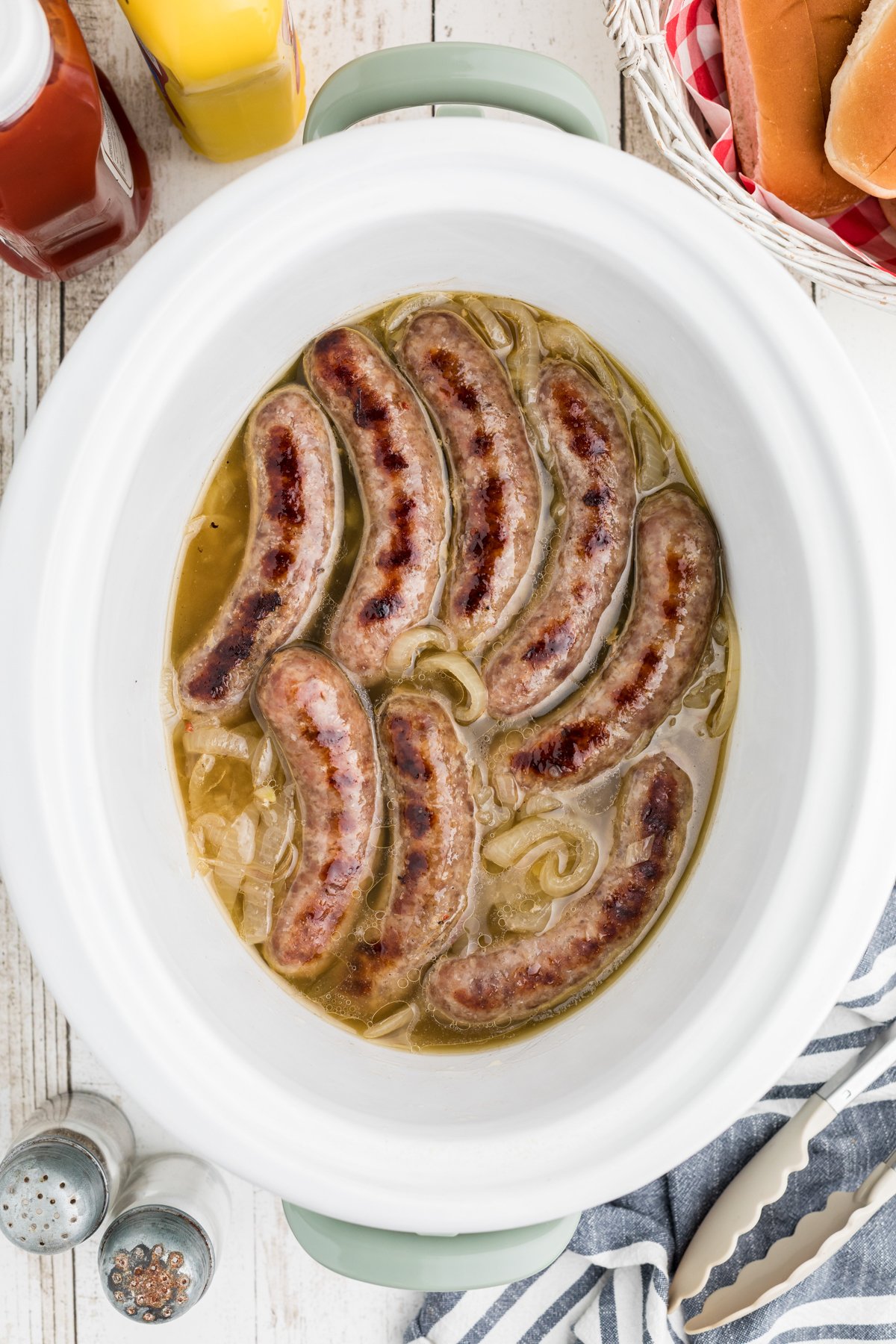 Brats in onion and beer in slow cooker.