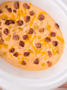 Cooked mississippi sin dip in a slow cooker.
