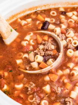Close up of pasta fagoli on a spoon.
