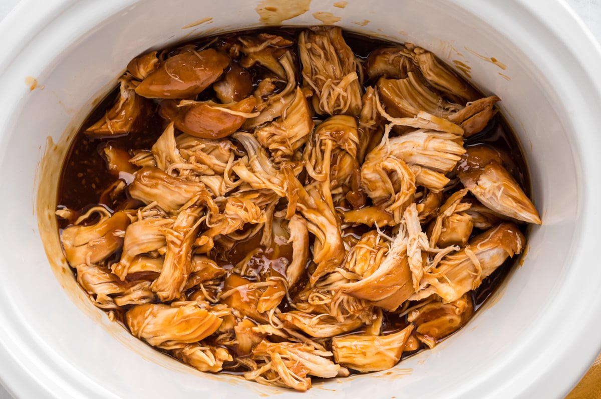 Overhead shot of teriyaki chicken in a slow cooker.