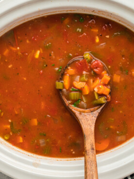 A slow cooker full of vegetable soup.