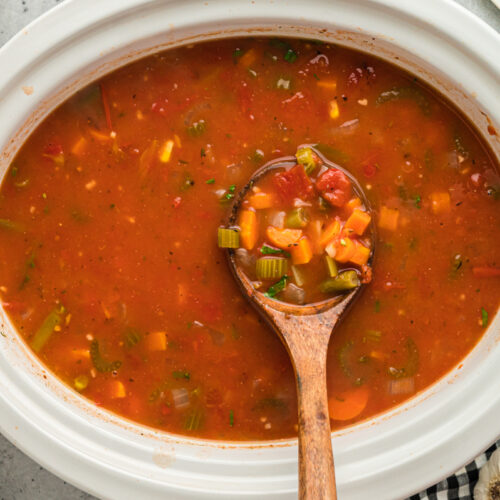 A slow cooker full of vegetable soup.