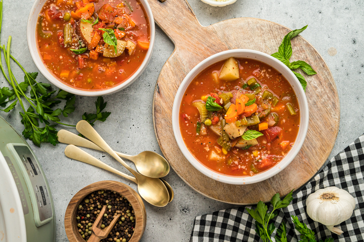 overhead shot of 2 bowls of vegetable soup.