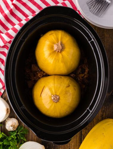 Cooked spaghetti squash and sauce in a slow cooker.