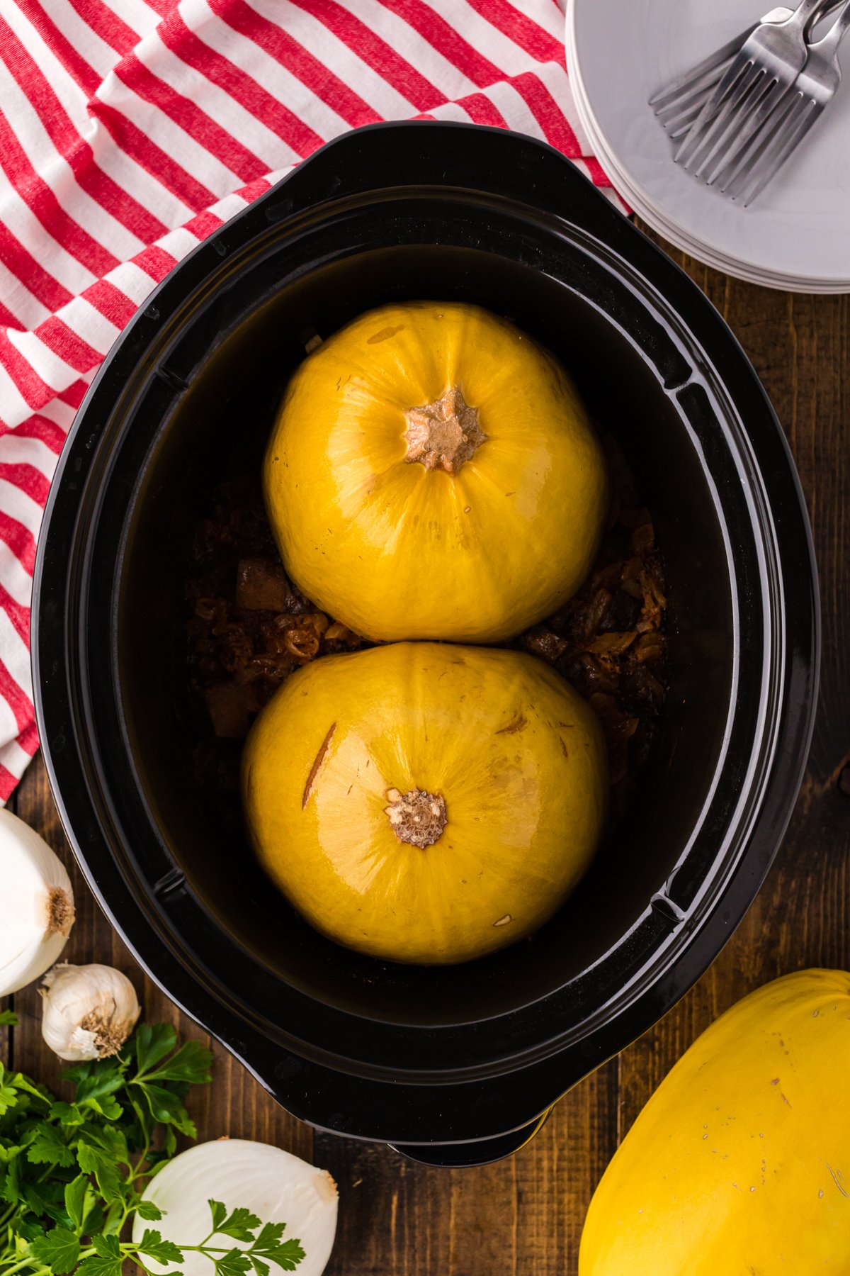 Cooked spaghetti squash and sauce in a slow cooker.