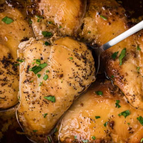 brown sugar chicken close up with a spatula. In a crockpot.