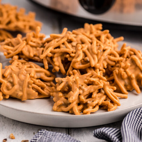 Plate of buttercotch haystacks in front of the slow cooker.