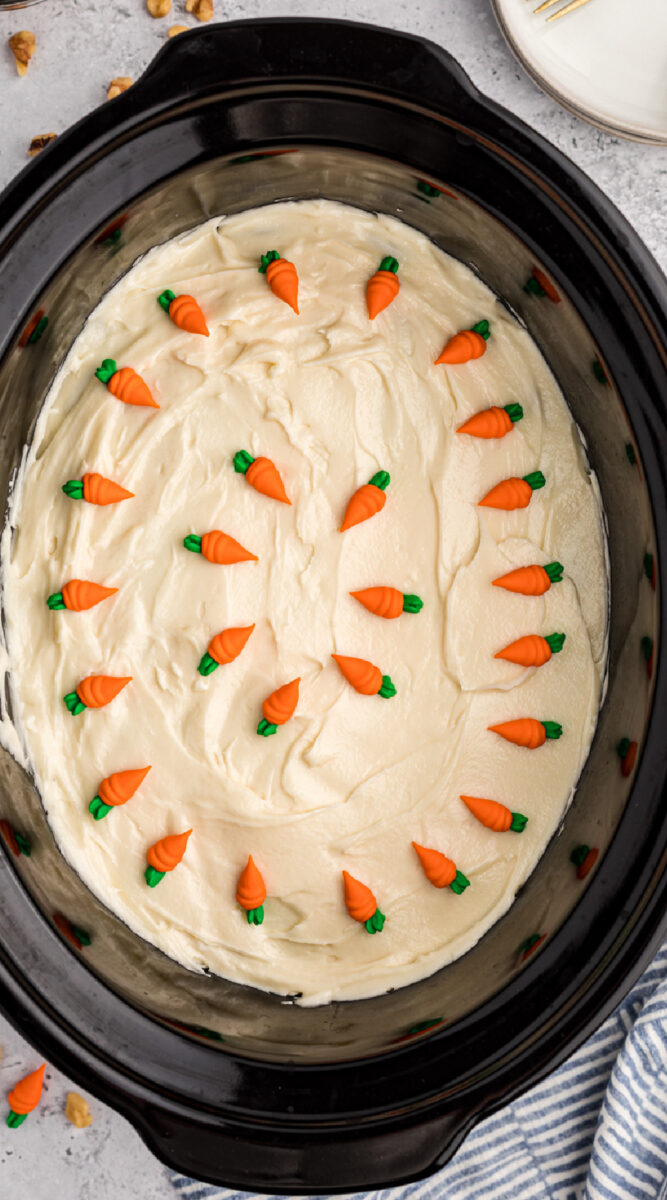 long image of carrot cake in a crockpot.