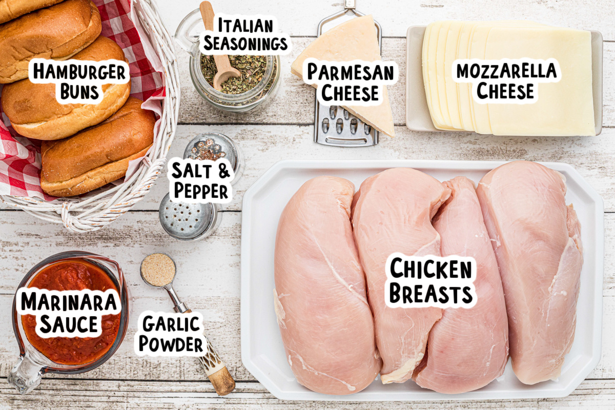 Ingredients for chicken parmesan sandwiches on a table.