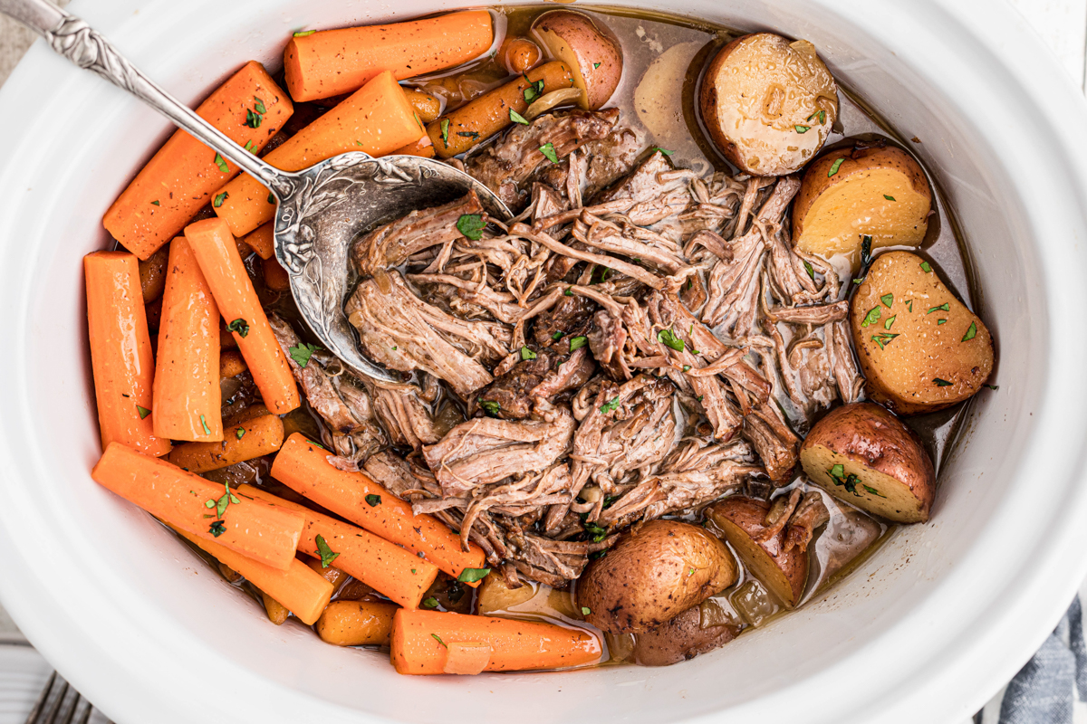 overhead shot of pot roast with a spoon in it.