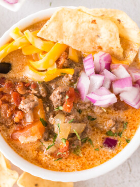 bowl of taco soup in a bowl with toppings.
