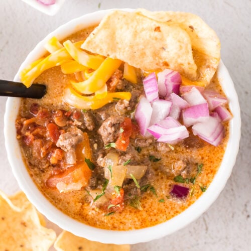 bowl of taco soup in a bowl with toppings.