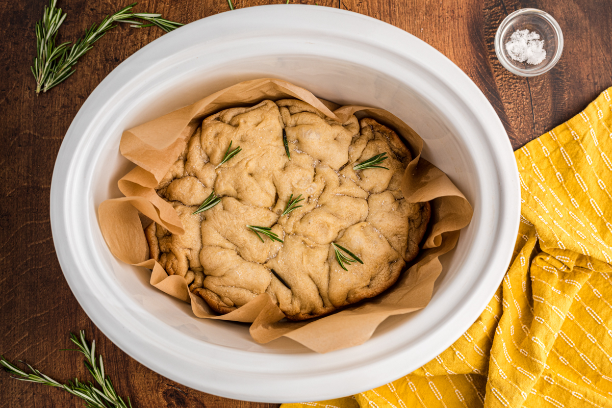 overhead shot of focaccia bread in a slow cooker.