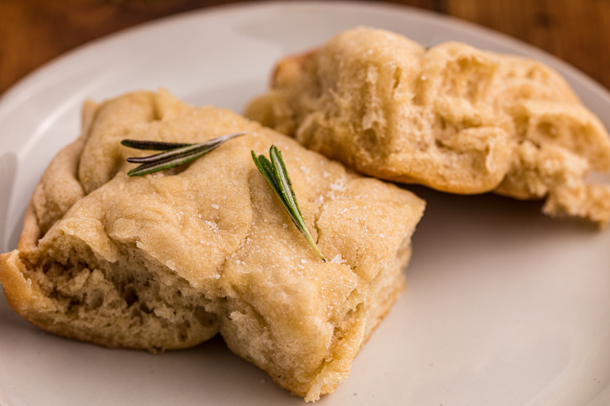 2 pieces of focaccia bread on a plate.