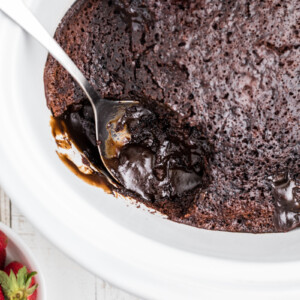 lave cake in crock pot with a spoonful taken out.