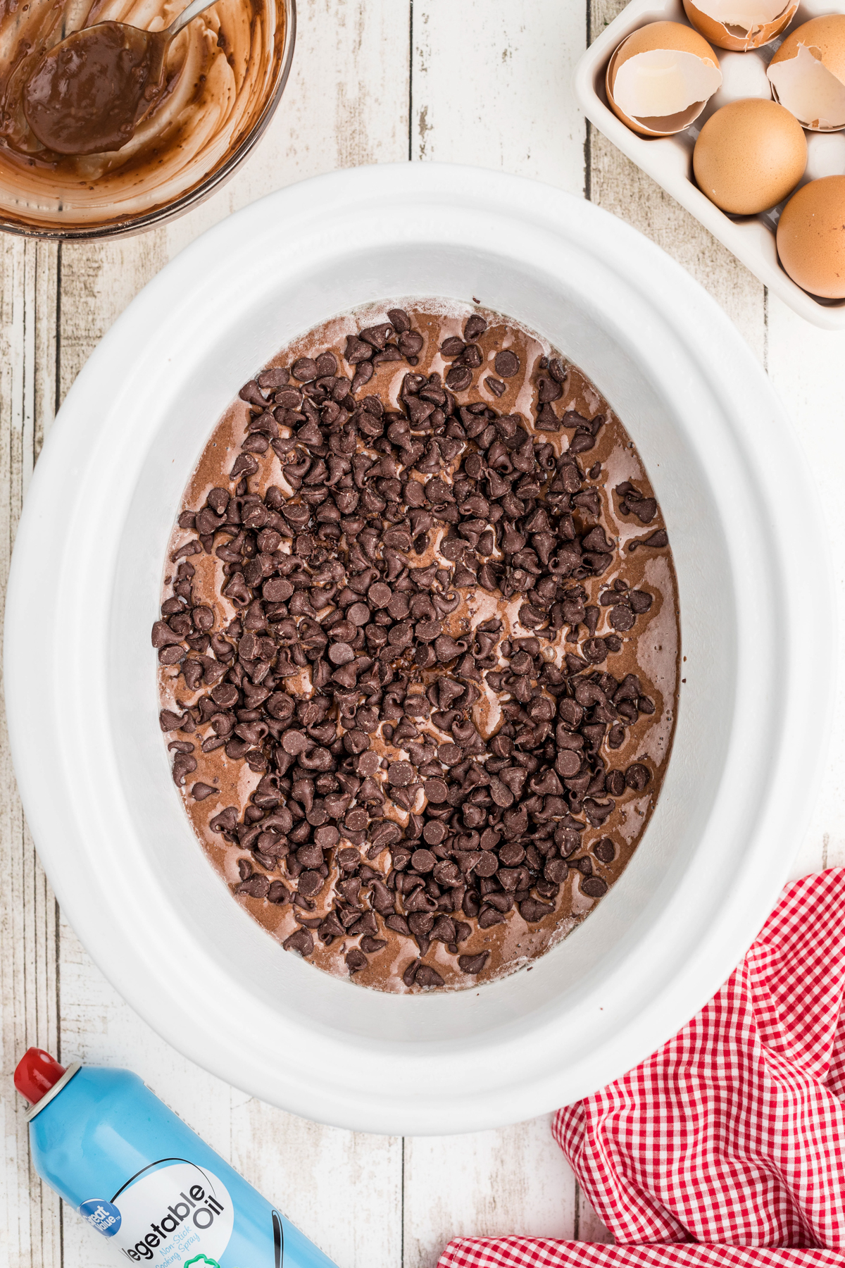 chocolate chips on top of cake mix in a slow cooker.