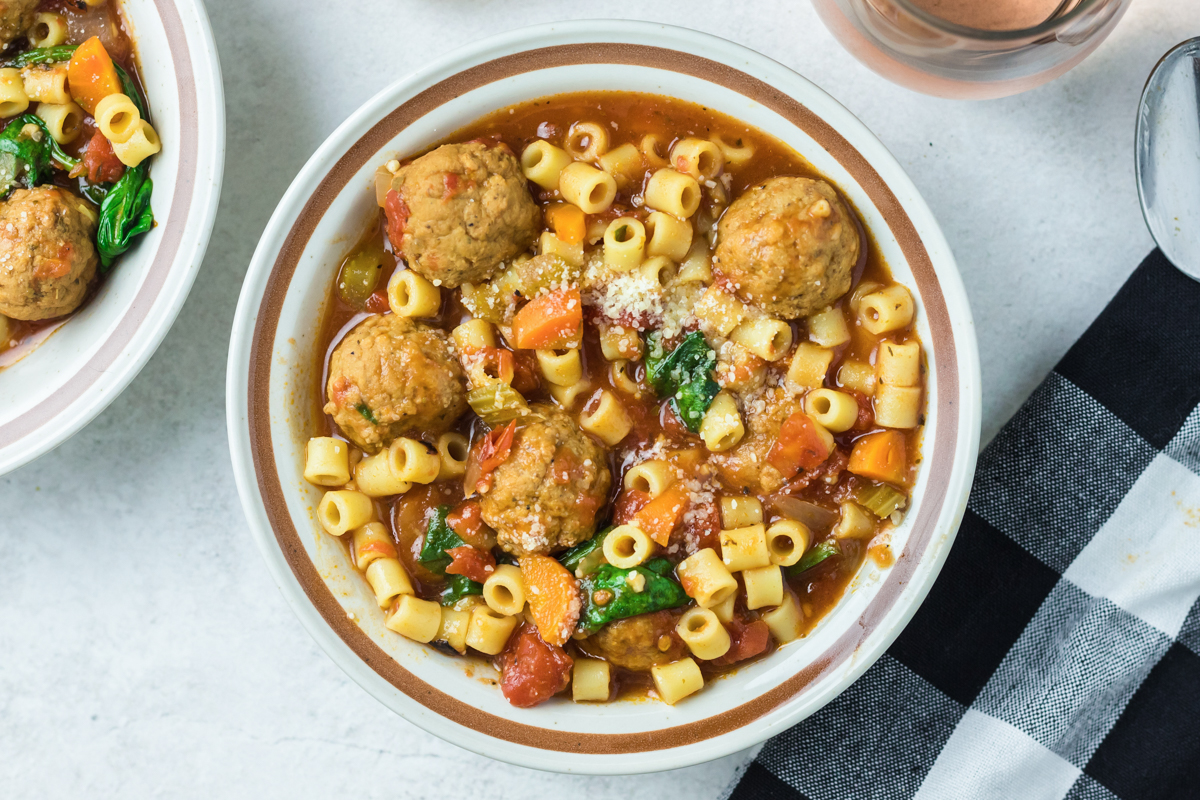 overhead shot of meatball soup in a bowl.